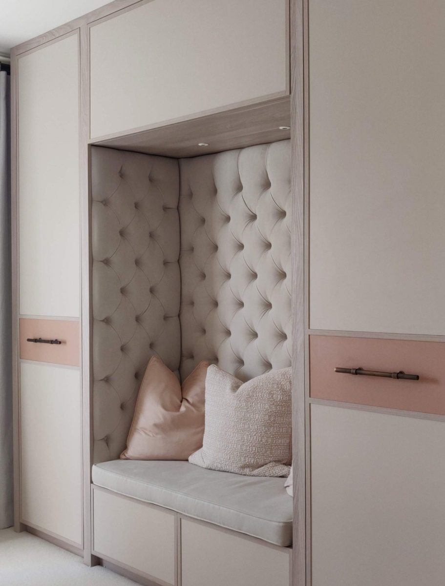 Tivoli wardrobe with reading nook A modern, stylish nook with padded walls and cushions in soft, neutral tones.